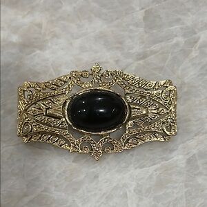 Elegant Gold and Black Brooch
